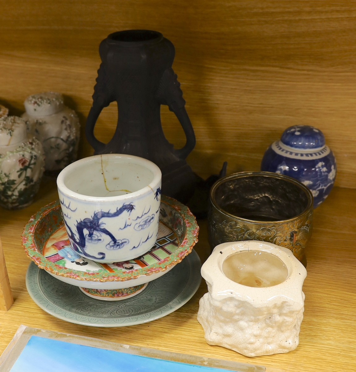 A Chinese blue and white planter, 10cm tall, together with a crackle glaze planter, a Chinese copper and brass jardiniere, a faux bronze type vase, a Chinese famille rose pedestal dish, 23cm, a Thai celadon dish, and a b